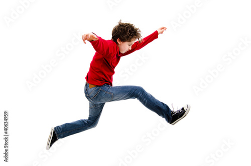 Photo: Boy jumping, running isolated on white background Boy jumping, running isolated on white background