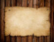 old torn paper pinned by nails to grunge wooden wall old torn paper pinned by nails to grunge wooden wall