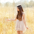 Asian indian woman walking in golden dried field Asian indian woman walking in golden dried field
