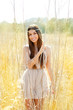 Asian indian woman walking in golden dried field Asian indian woman walking in golden dried field