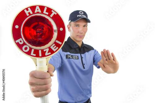 Photo: Polizist in Uniform stoppt Polizist in Uniform stoppt