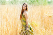 Asian indian woman walking outdoors in golden field Asian indian woman walking outdoors in golden field
