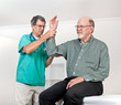 Doctor Examines Patient's Wincing with Pain in Arm
