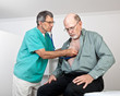 Doctor or Nurse Listens to Older Patient's Heart and Lungs