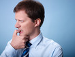 Photo: nervous business man biting finger nails nervous business man biting finger nails