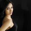 Beautiful young woman in little black dress
