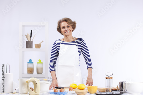 Photo: Senior woman cooking Senior woman cooking