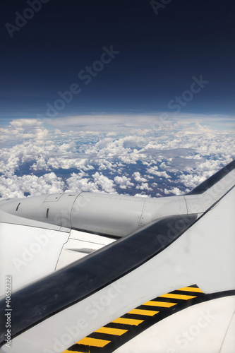 Photo: Airplane flying above the clouds Airplane flying above the clouds