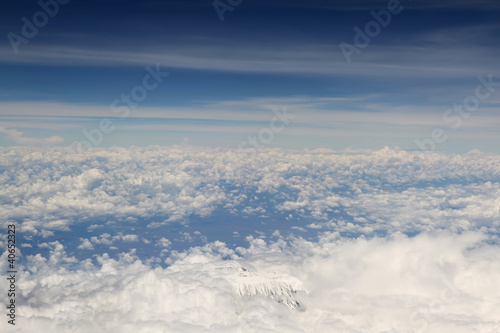 Photo: Kilimanjaro top from above, surrounded with white clouds Kilimanjaro top from above, surrounded with white clouds