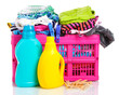 Clothes with detergent in pink plastic basket isolated on white Clothes with detergent in pink plastic basket isolated on white
