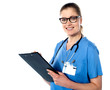 Friendly female doctor with a clipboard