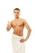 Wet muscular man wrapped a white towel isolated on white Wet muscular man wrapped a white towel isolated on white