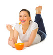 Young girl laying on the floor with fruit salad