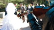 Just Married Couple Dancing To A Violin Accompaniment
