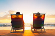 Happy Romantic Couple Enjoying Beautiful Sunset at the Beach