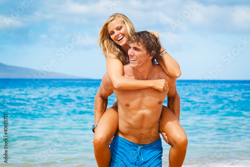Photo: Young Couple on Tropical Beach Young Couple on Tropical Beach