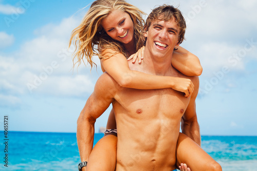 Photo: Young Couple on Tropical Beach Young Couple on Tropical Beach