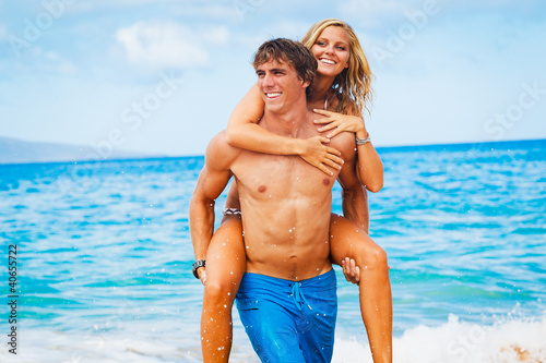 Photo: Young Couple on Tropical Beach Young Couple on Tropical Beach