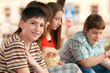 Smiling teenage boy spending time with his friends