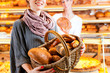 Salesperson with female customer in bakery