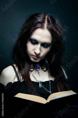 Photo: Witch with spell book Witch with spell book