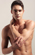 Portrait of strong fitness handsome sports man, looking in the c