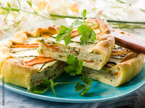 Photo: vegetables cake over dish on wood background vegetables cake over dish on wood background