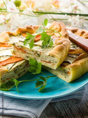 Photo: vegetables cake over dish on wood background vegetables cake over dish on wood background