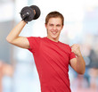 young man doing fitness with weights indoor young man doing fitness with weights indoor