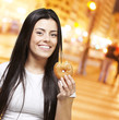 woman holding a donut woman holding a donut