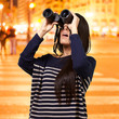 portrait of young girl looking through a binoculars at night cit portrait of young girl looking through a binoculars at night cit
