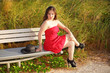 Woman sitting in a red dress