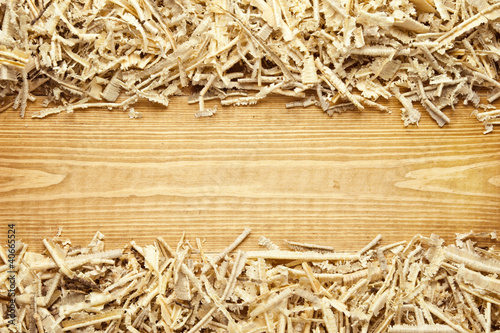 Photo: Wooden sawdust and shavings background with space for text Wooden sawdust and shavings background with space for text