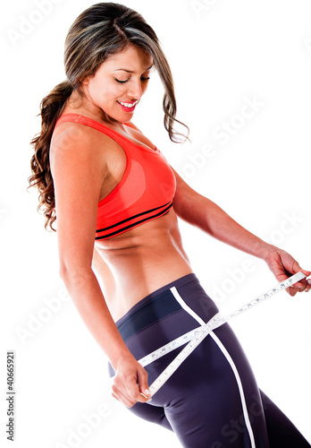 Foto: Woman measuring her body Woman measuring her body