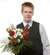 The pupil in a school uniform with a bouquet of flowers The pupil in a school uniform with a bouquet of flowers