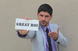 Photo: Great ROI Sign - Holded by a businessman Great ROI Sign - Holded by a businessman