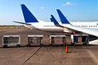 Airplane with luggage cars