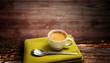 A cup of coffee on wood background