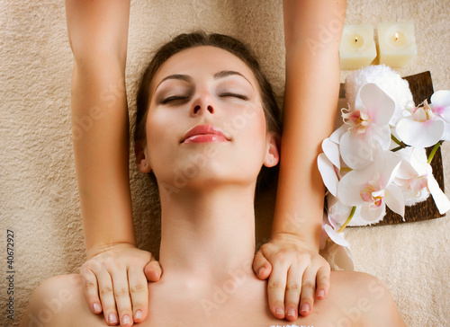 Photo: Spa Massage. Beauty Woman Getting Massage Spa Massage. Beauty Woman Getting Massage