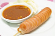 Fried balls chili sauce on white background.