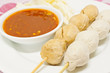 Fried balls chili sauce on white background.