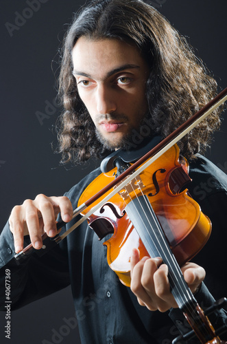Photo: Fiddler playing the violin Fiddler playing the violin