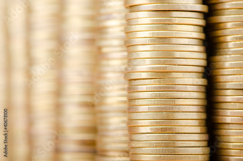 Photo: Golden coins in high stacks Golden coins in high stacks