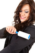 business woman cleaning dust with lint roller