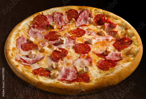 Photo: Pizza misto carne - isolated Pizza misto carne - isolated