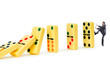 canvas print picture - Businessman and dominoes isolated on the white
