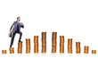 Businessman climbing gold coins stacks