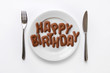 Plate with letter biscuits spelling out the words Happy Birthday