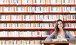 Portrait of a student  girl studying at library