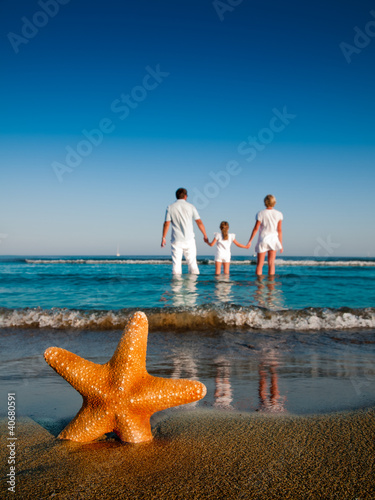 Photo: summer holiday - family at the beach summer holiday - family at the beach
